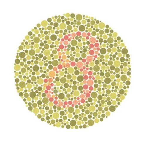 Planche d'Ishihara n° 2 : un chiffre en points rosés sur un fond de points vert-jaune